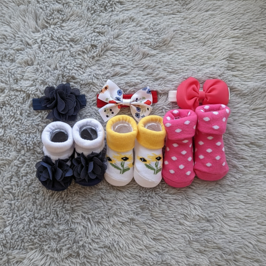 Baby Girl Headband & Sock Gift Set on Grey Fur Blanket