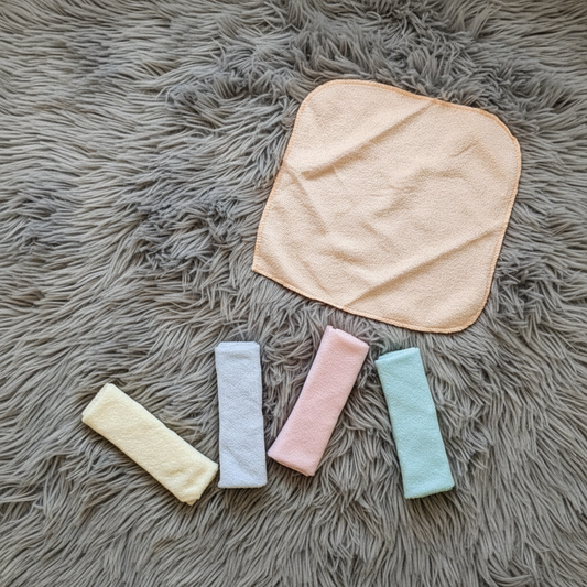 Peach Baby Washcloth Set on Grey Fur